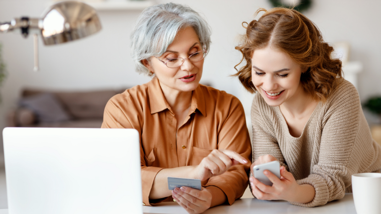People in front of a laptop